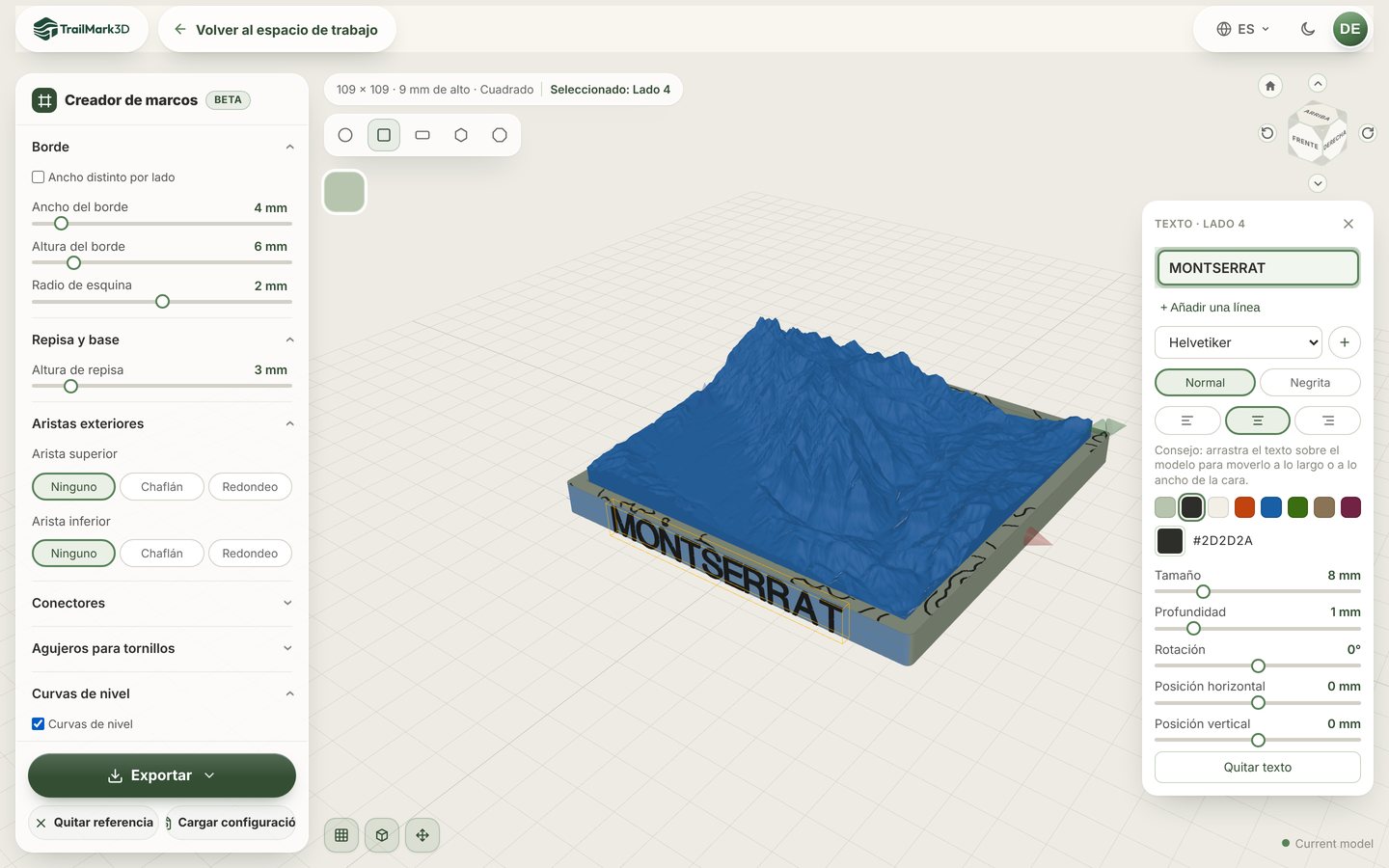 Un marco impreso en 3D diseñado en el Creador de marcos de TrailMark3D alrededor de un modelo de terreno de Montserrat, con MONTSERRAT en texto oscuro en relieve en el frente y curvas de nivel en el borde