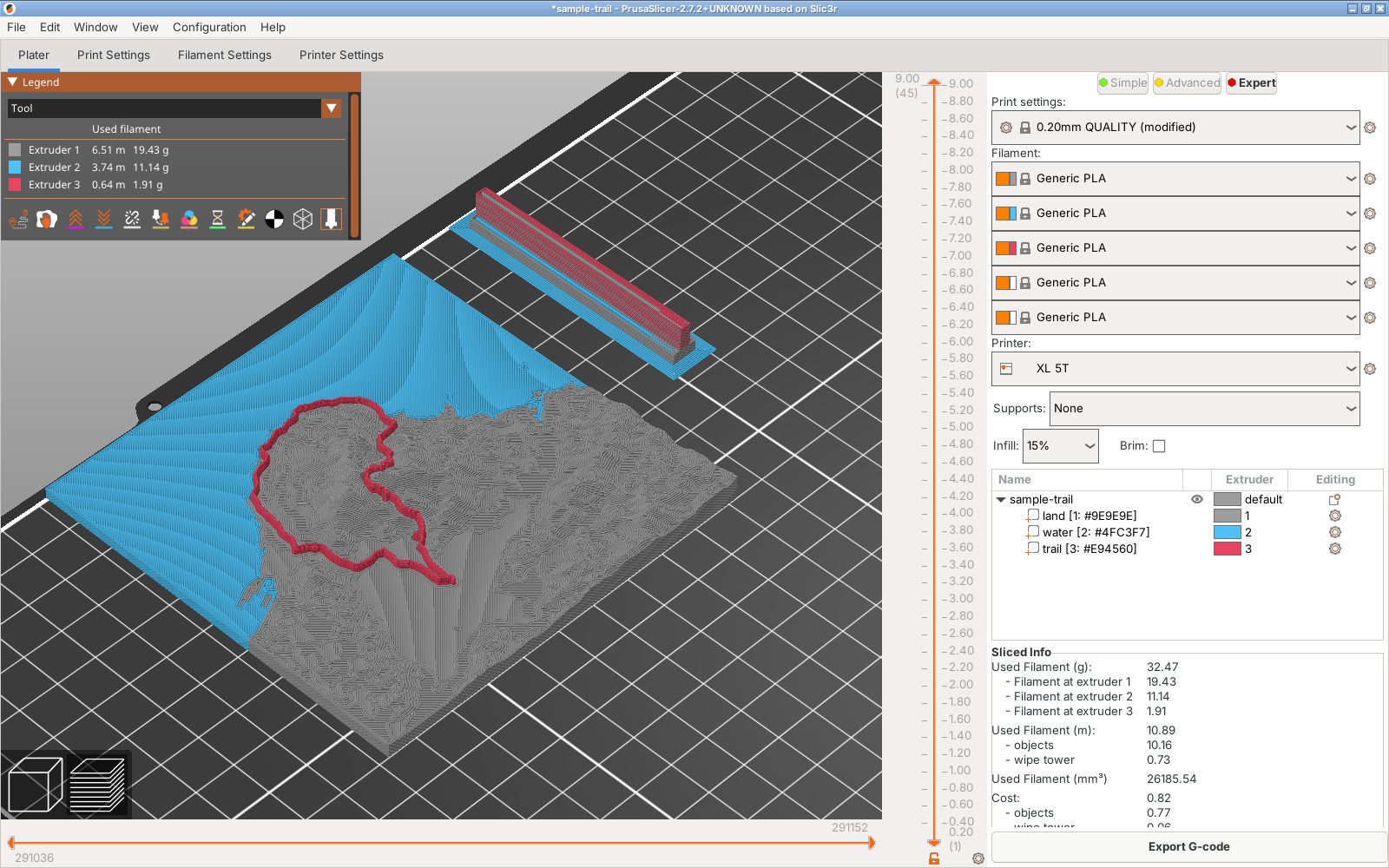 The sliced terrain model in PrusaSlicer with the land in gray, the sea in blue and the trail in red, and the filament used per extruder